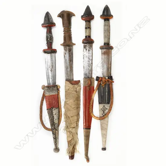 A collection of four daggers,